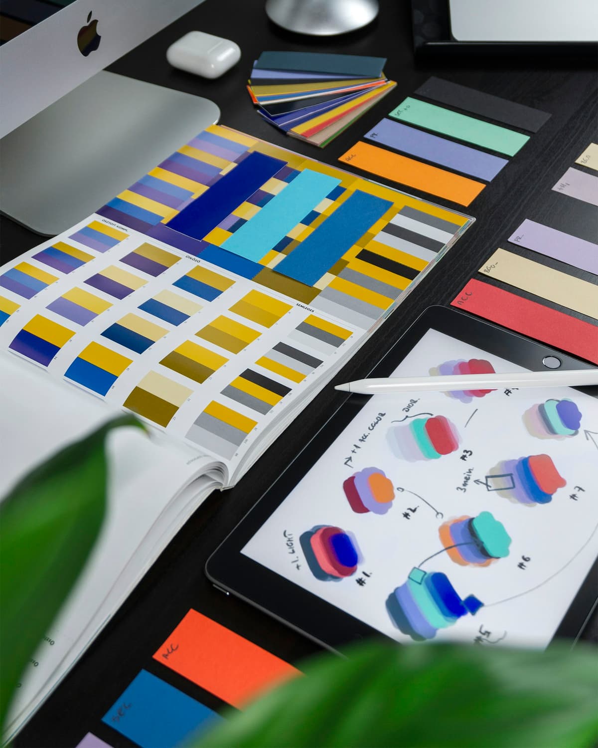 UI UX designer working on a colorful interface layout and design system on a desktop computer